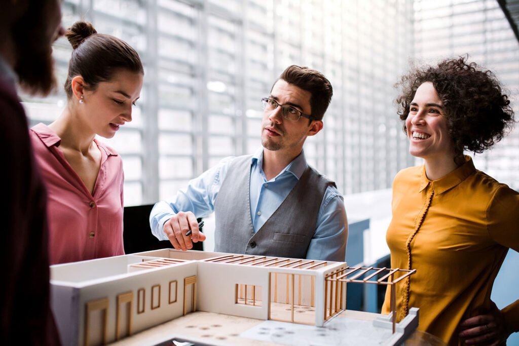 Architects with house model